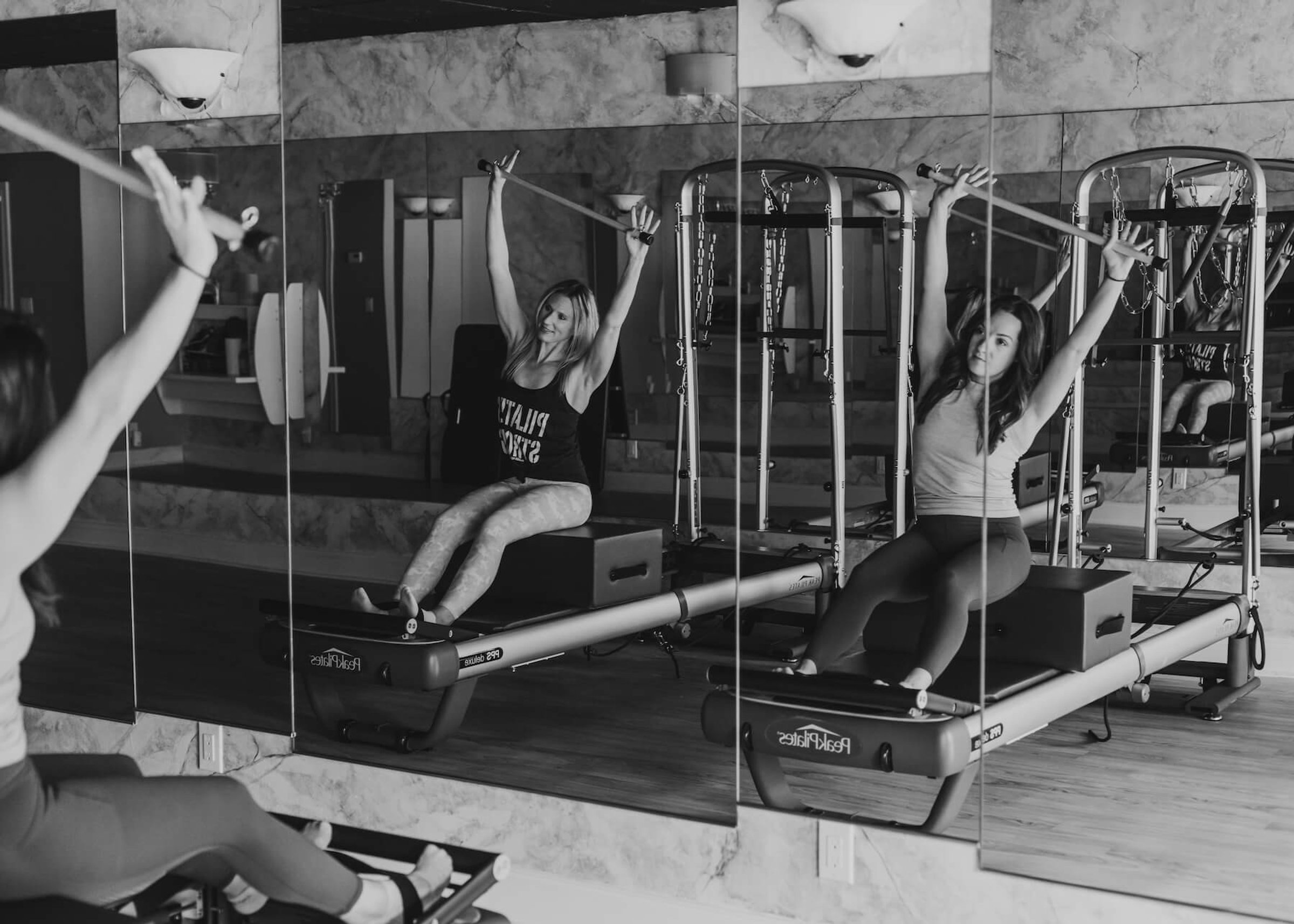 Clients training on reformers at CSFit Pilates