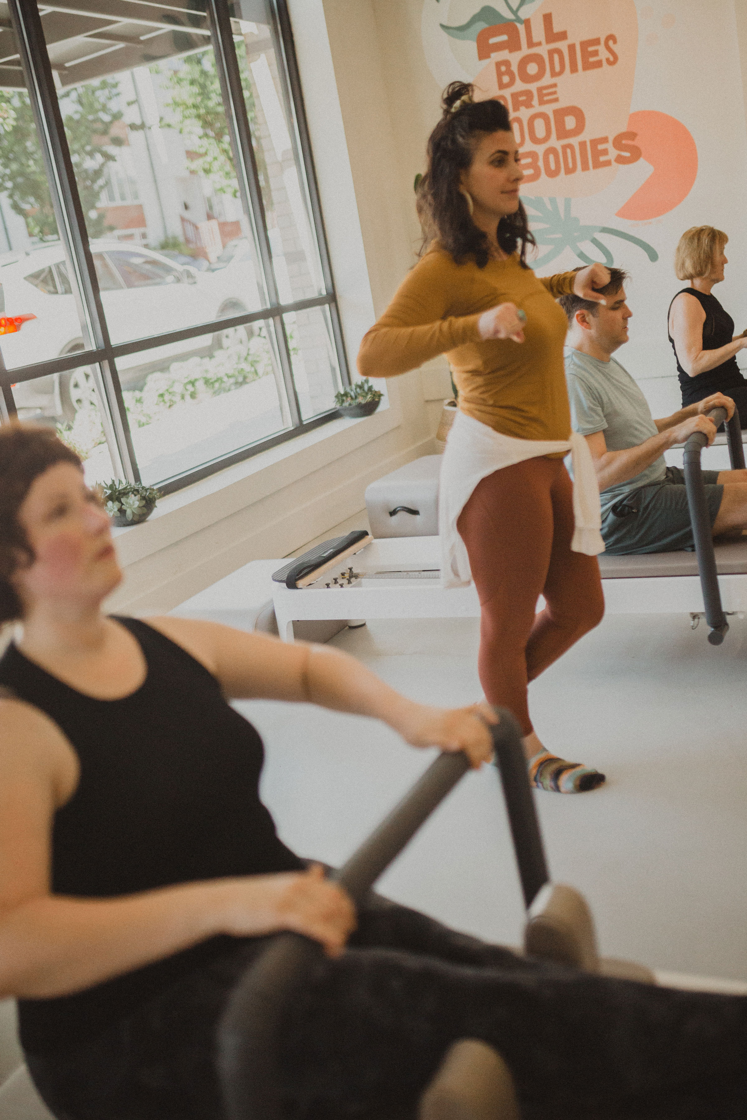 Two clients doing a duet Pilates session together
